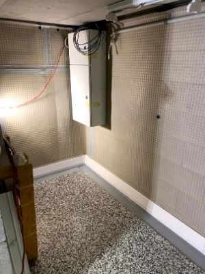 Waterproofing installation of Type C cavity drain membrane around electrical services